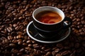 a cup of coffee sits on top of a pile of coffee beans Royalty Free Stock Photo