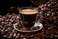 a cup of coffee sitting on top of a pile of coffee beans Royalty Free Stock Photo