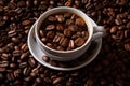 a cup of coffee sitting on top of a pile of coffee beans Royalty Free Stock Photo