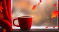 A cup of coffee sitting on a window sill, and red maple leaves falling in the air. Royalty Free Stock Photo