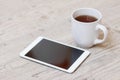 Cup of coffee, smart phone and tablet Royalty Free Stock Photo