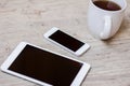 Cup of coffee, smart phone and tablet Royalty Free Stock Photo