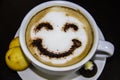 the cup of coffee with smile on the table. The biscuits with candy. Smile. Be happy with coffe Royalty Free Stock Photo