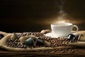 A cup of coffee with smoke and coffee beans and coffee capsules on burlap sack on old wooden background Royalty Free Stock Photo