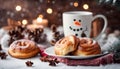 A cup of coffee with a snowman on it and two cinnamon rolls on a plate Royalty Free Stock Photo