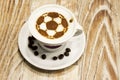 A cup of coffee with soccer ball Royalty Free Stock Photo