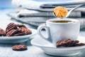 Cup of coffee spoon with cane sugar, chocolate biscuits and the background newspaper. Royalty Free Stock Photo