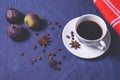 A cup of coffee, sprinkled with aromatic coffee beans, anise and ripe three figs Royalty Free Stock Photo