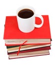 Cup of coffee on stack of books Royalty Free Stock Photo