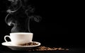 Cup coffee with steam and beans on a black background, a place for text