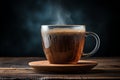 a cup of coffee with steam coming out of it on a wooden table Royalty Free Stock Photo