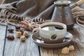 Cup of coffee with sugar and spices and a wooden box with grains Royalty Free Stock Photo