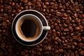 a cup of coffee is surrounded by coffee beans Royalty Free Stock Photo