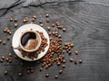 Cup of coffee surrounded by coffee beans. Top view. Royalty Free Stock Photo