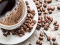 Cup of coffee surrounded by coffee beans. Top view. Royalty Free Stock Photo