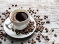 Cup of coffee surrounded by coffee beans. Top view. Royalty Free Stock Photo