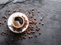 Cup of coffee surrounded by coffee beans. Top view Royalty Free Stock Photo