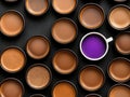 A cup of coffee surrounded by many different types of coffee Royalty Free Stock Photo