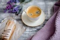 Cup of coffee and sweater on a wooden background Royalty Free Stock Photo