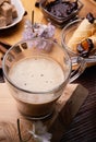 Cup of coffee with sweets for coffee served at wooden tray at black wooden table. festyle concept Royalty Free Stock Photo