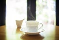 Cup of coffee on table in cafe interior Royalty Free Stock Photo