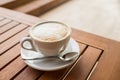 Ceramic cup of coffee on table in coffee shop cafe.coffee cup latte art in cafe on wooden table.Classic Coffee Cup Royalty Free Stock Photo