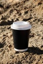 Cup of coffee on a table over blue sky and empty sea beachside. Summer holiday concept. Mock up, copy space Royalty Free Stock Photo