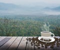 Cup with coffee on table over mountains Royalty Free Stock Photo