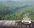 Cup with coffee on table over mountains Royalty Free Stock Photo