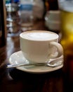 Cup of coffee on table in coffee shop Royalty Free Stock Photo