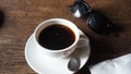 A cup of Coffee on the table and sunglasseses Royalty Free Stock Photo