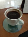 a cup of coffee on the table to get rid of sleepiness