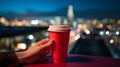 cup of coffee on window topin street cafe at night ,view on rainy city blurred light Royalty Free Stock Photo