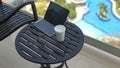 Cup of coffee and tablet in a balcony during vacation Royalty Free Stock Photo