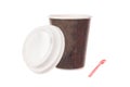 Cup of coffee for take away with cap and spoon Royalty Free Stock Photo