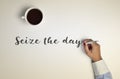 Cup of coffee and text seize the day