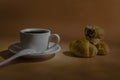 A cup of coffee and three mini croissants Royalty Free Stock Photo