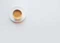 Cup of coffee - top view minimalist composition on a white background. White mug with espresso, flatlay Royalty Free Stock Photo