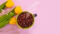 Cup coffee. tulip flower on colored background