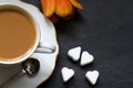 Cup of coffee with tulip and sugar heart valentine breakfast