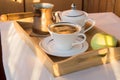 Cup of coffee, Turk, Apple on wooden plate closeup. Breakfast, Selective focus.