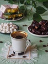 A cup of coffee and Turkish sweets. Sweet food in Ramadan. Royalty Free Stock Photo