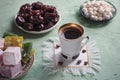 A cup of coffee and Turkish sweets. Sweet food in Ramadan. Royalty Free Stock Photo