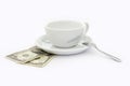 Cup of coffee with two dollars tip Royalty Free Stock Photo
