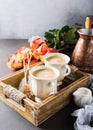 Cup of coffee in vintage wooden tray Royalty Free Stock Photo