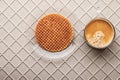 Cup of coffee with wafer on the relief background top view Royalty Free Stock Photo