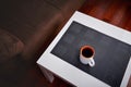 Cup of coffee on a white coffee table in a living room. Concept of lazy afternoon. Royalty Free Stock Photo