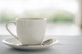 Cup of coffee on white table at coffee cafe. Royalty Free Stock Photo