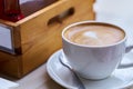 A cup of coffee in a white cup on table, Hot latte coffee in cafe Royalty Free Stock Photo