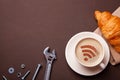 Cup of coffee with WiFi sign on the foam. Free access point to the Internet WiFi. I like coffee break with croissant Royalty Free Stock Photo